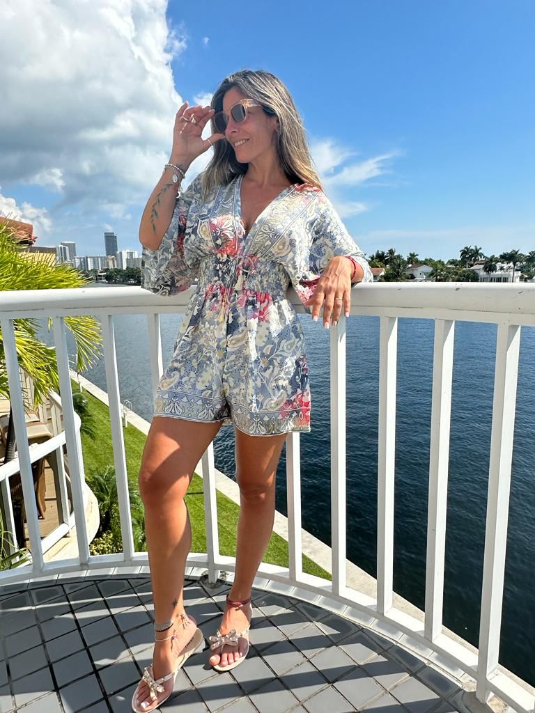 Model wearing Fernanda short silk-blend romper with short sleeves, summer resort outfit