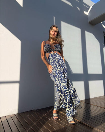 woman wearing long blue and cream rayon maxi dress with V-neckline perfect for summer