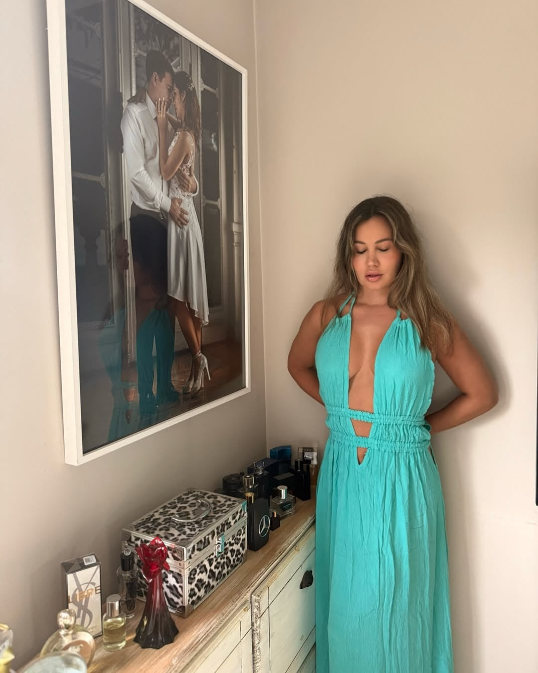 model in front view wearing sleeveless green rayon maxi dress with deep V-neckline