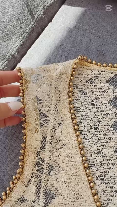 video with music showing lucy cream beach cover-up embroidered with golden beads