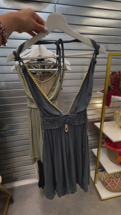 video of blue short rayon dress with golden bead details displayed in store